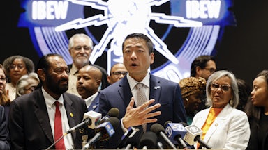 Texas Representative Gene Wu speaks in front of Democratic members of Congress and Texas House Democrats during a news conference, after they left their state to deny Republicans the quorum needed to redraw the state’s 38 congressional districts.