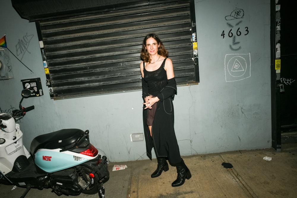 Emily Witt standing outside Mansions, a wine bar in Queens, September 18, 2024.