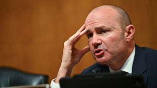 Senator Mike Lee touches his face while speaking during a Senate subcommittee hearing