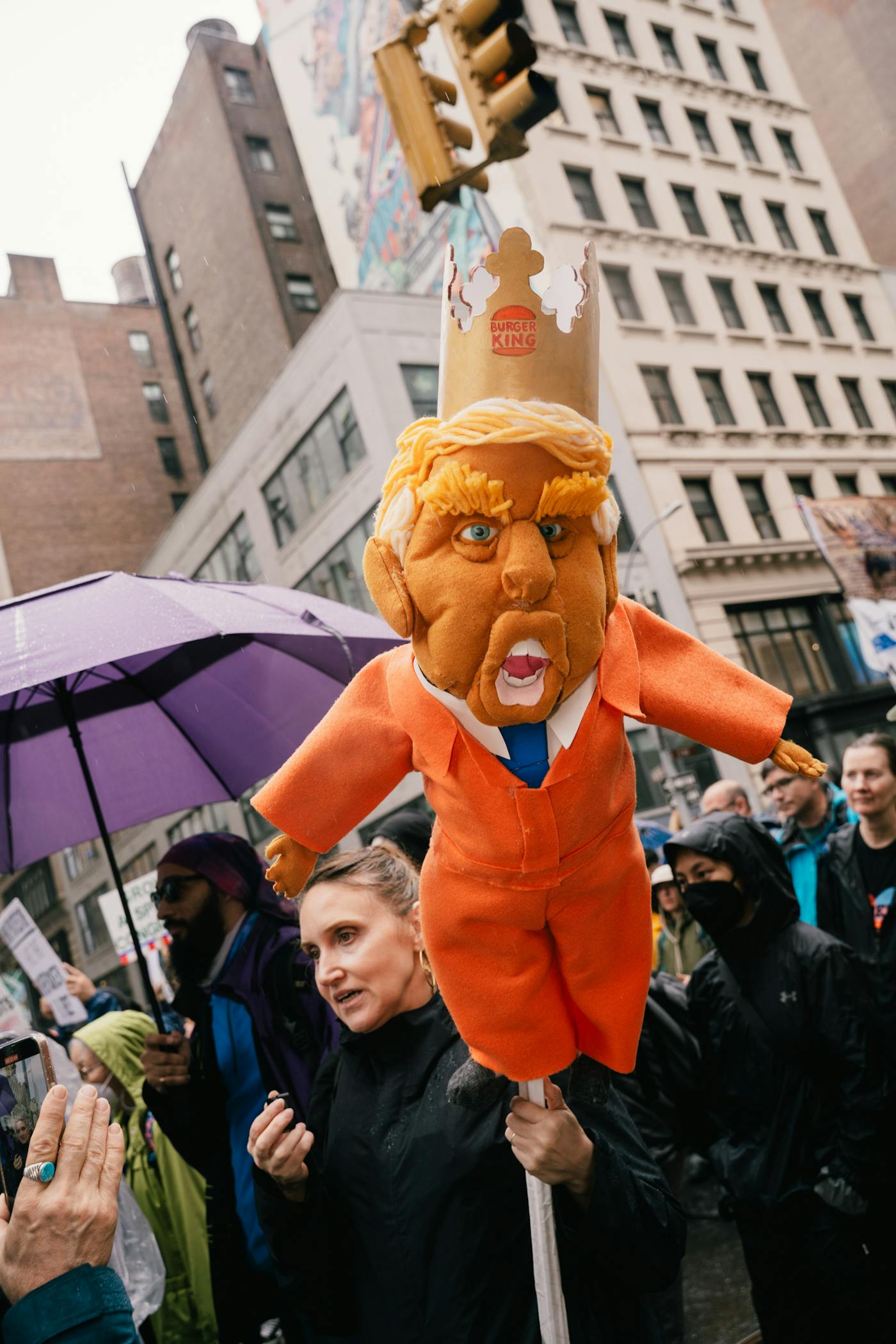 An effegy of Trump on a pole held by a protester in New York City on Sunday at the No Kings event 