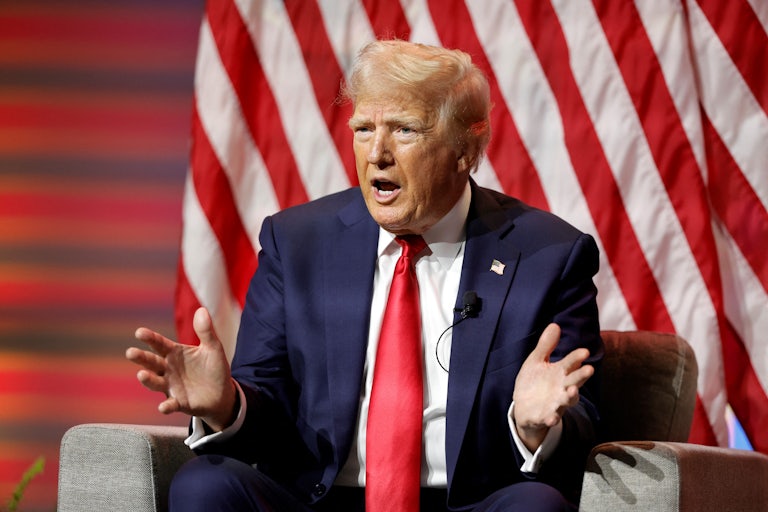 Donald Trump gestures during an interview at the National Association of Black Journalists
