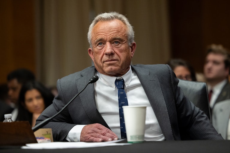 Robert F. Kennedy Jr. sits at a table during his Senate confirmation hearing
