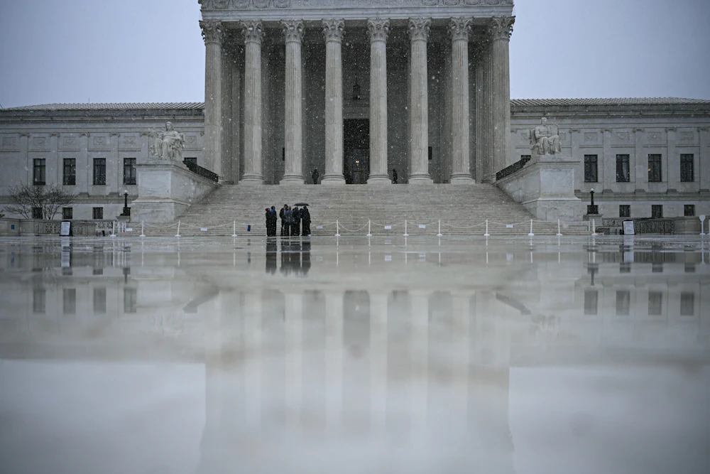 Snow flurries fall outisde the US Supreme Court in Washington, DC, on March 12, 2026.