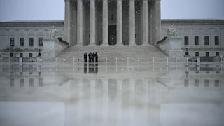 Snow flurries fall outisde the US Supreme Court in Washington, DC, on March 12, 2026.