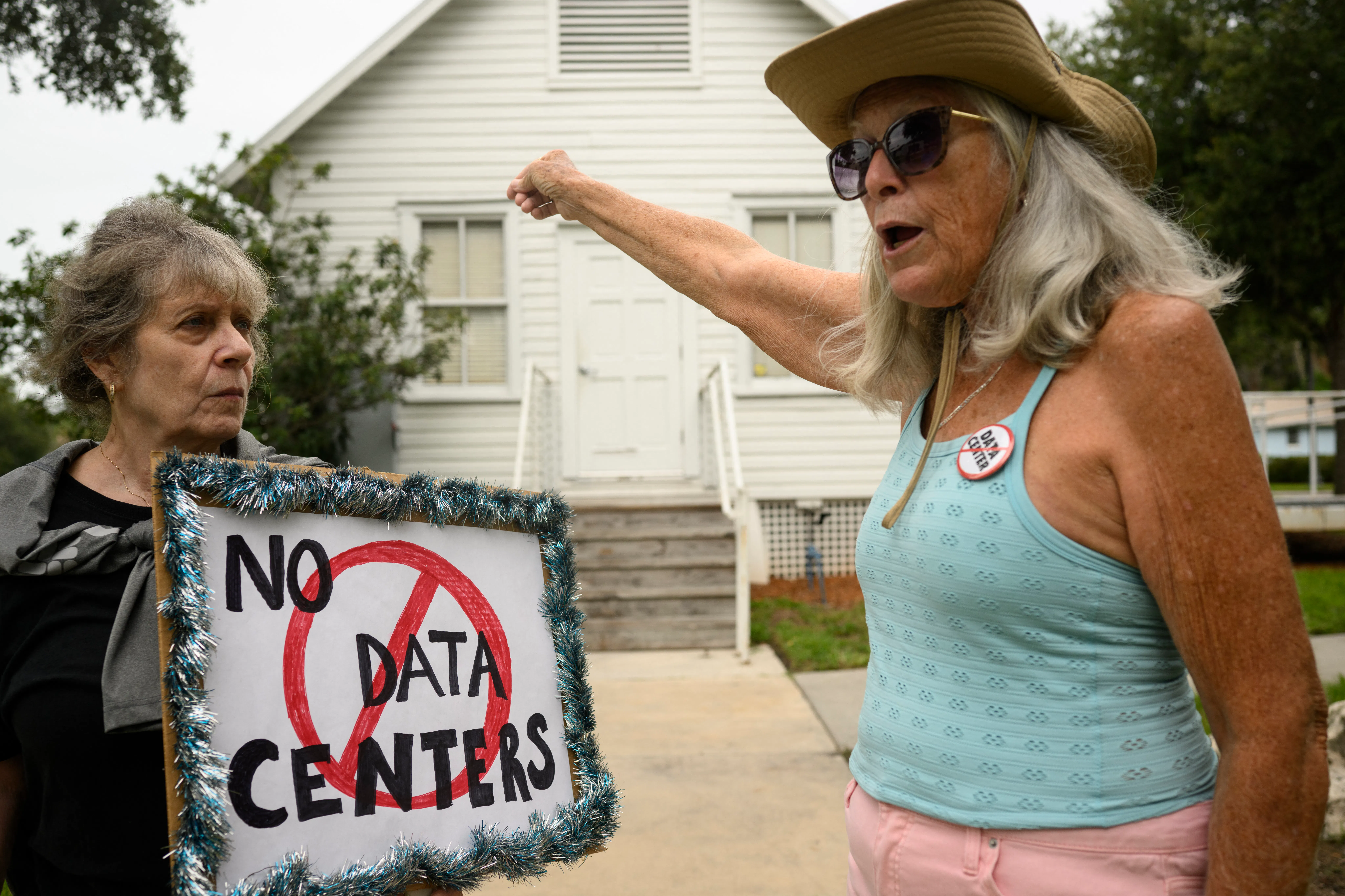 People demonstrate outside Peace Hall in New Port Richey, Florida, during a nationwide protest against AI data center expansion on July 18.