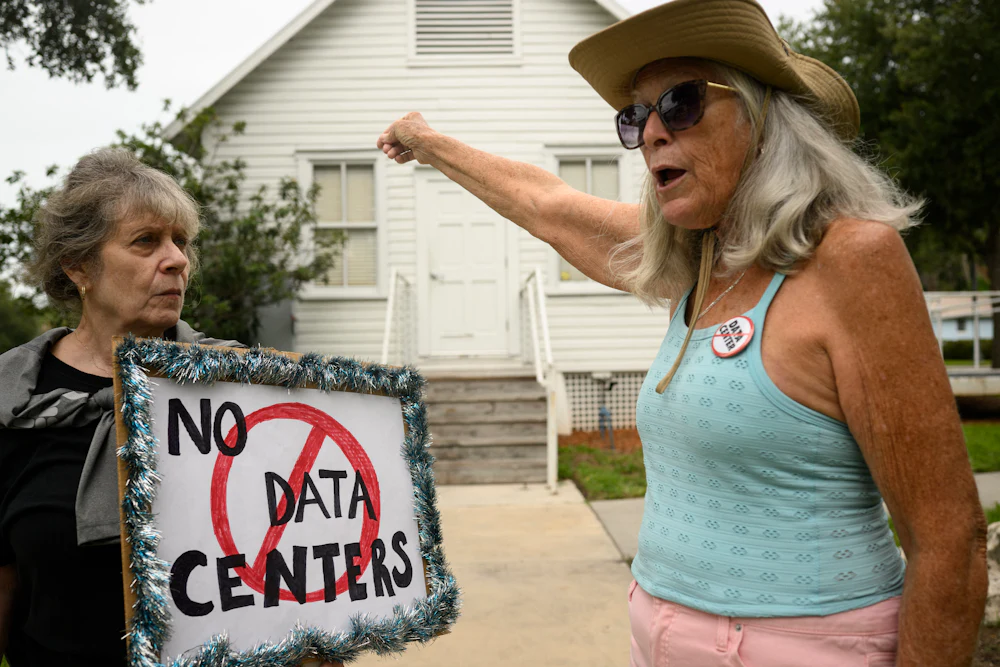 People demonstrate outside Peace Hall in New Port Richey, Florida, during a nationwide protest against AI data center expansion on July 18.
