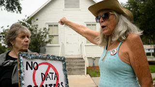 People demonstrate outside Peace Hall in New Port Richey, Florida, during a nationwide protest against AI data center expansion on July 18.