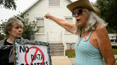 People demonstrate outside Peace Hall in New Port Richey, Florida, during a nationwide protest against AI data center expansion on July 18.