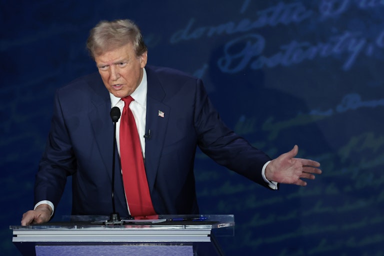 Donald Trump on the debate stage with Kamala Harris (not pictured)