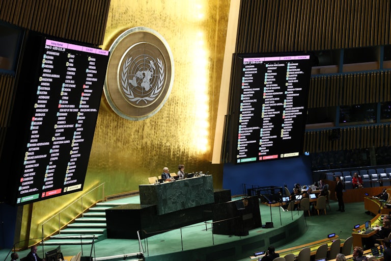 Results of votes on a draft resolution are displayed during a United Nations General Assembly meeting for a special session at the United Nations headquarters in New York City.