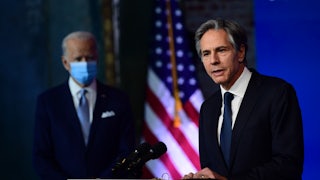 Antony Blinken speaks as Joe Biden looks on.