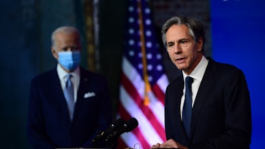 Antony Blinken speaks as Joe Biden looks on.