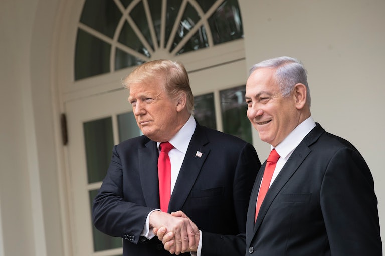 Donald Trump shakes Benjamin Netanyahu's hand outside the White House as both men smile
