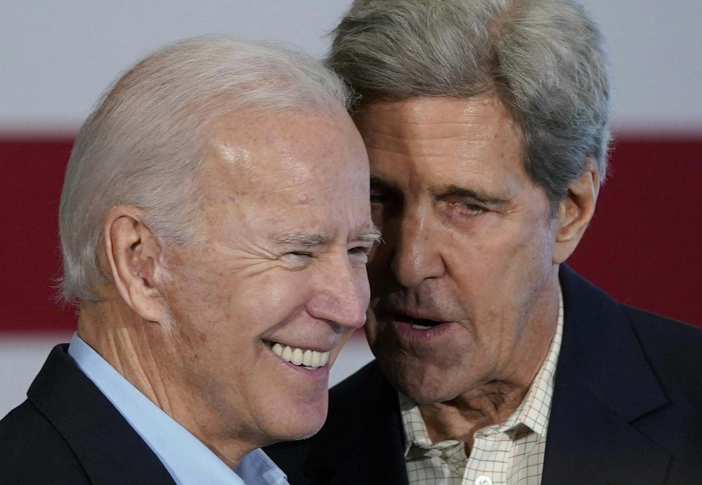 John Kerry speaks to Joe Biden.