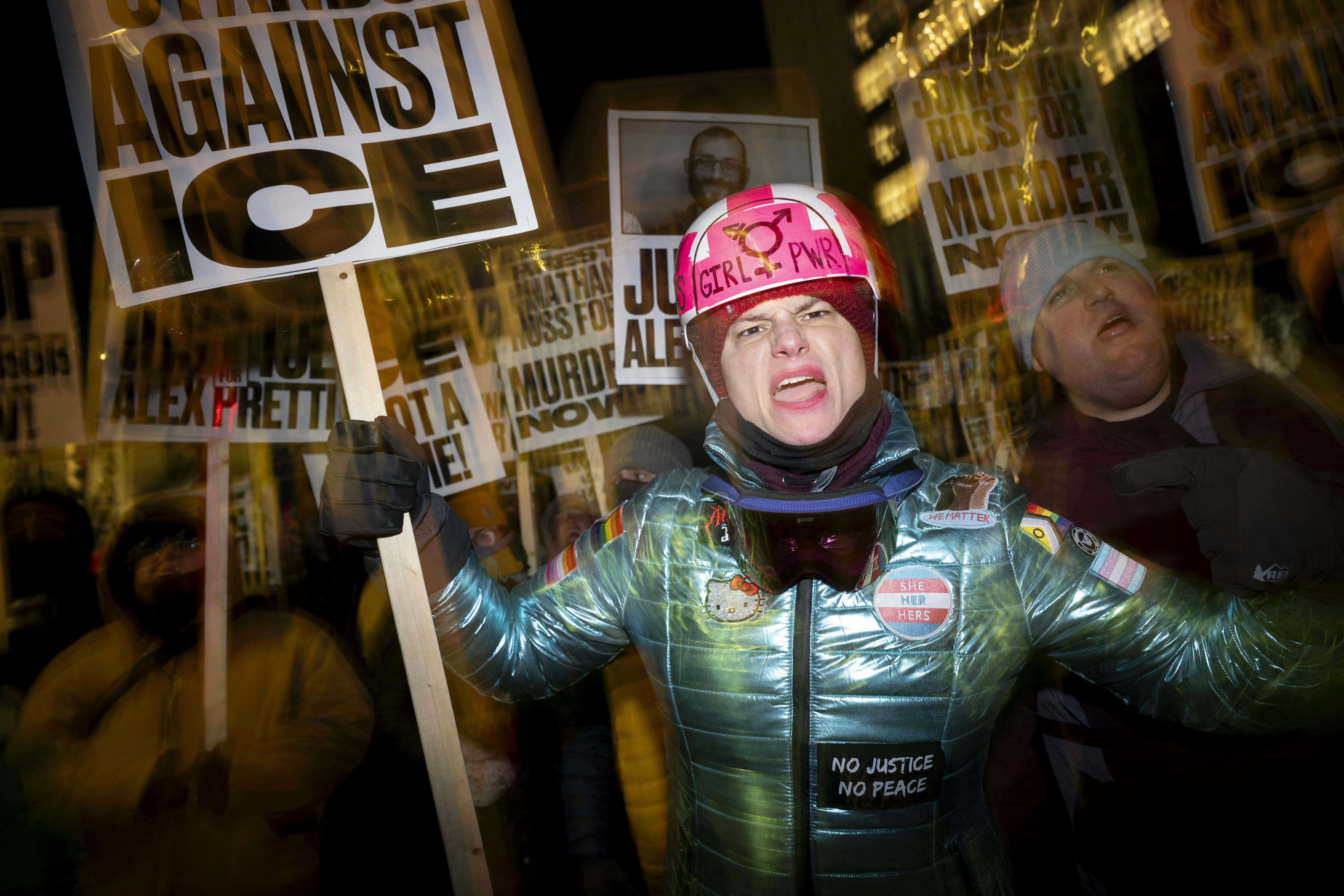 A group of anti-US Immigration and Customs Enforcement (ICE) protesters hold signs and shout slogans in downtown Minneapolis.