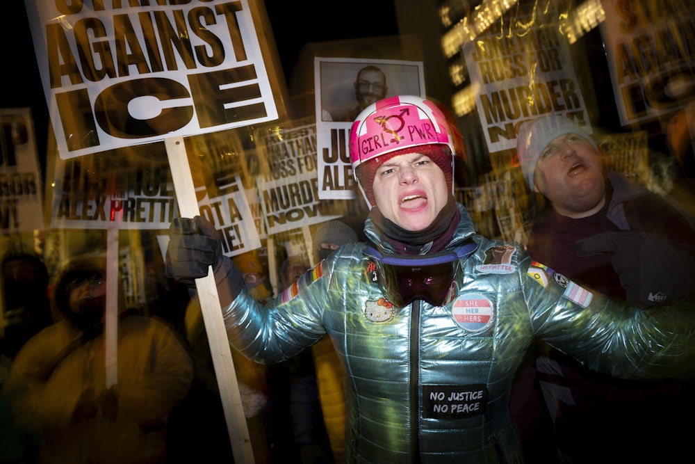 A group of anti-US Immigration and Customs Enforcement (ICE) protesters hold signs and shout slogans in downtown Minneapolis.