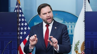Vice President JD Vance gestures and speaks at the podium of the White House press briefing room