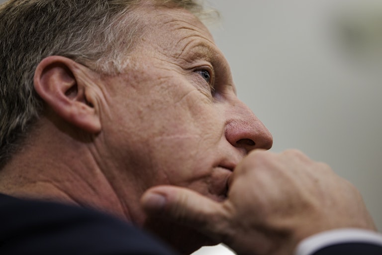 Representative Kevin Hern puts his hand to his chin