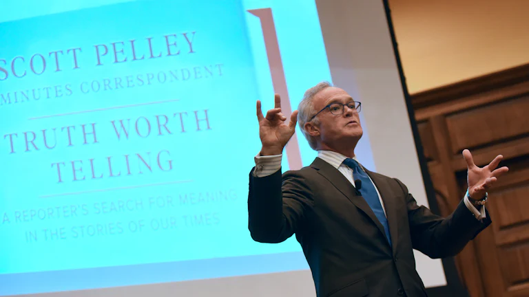 Scott Pelley speaking at a book event