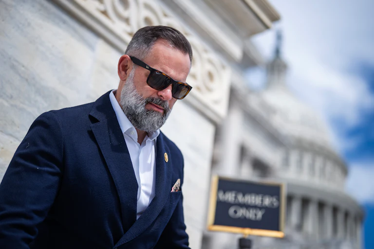 Representative Cory Mills walks down the steps of the Capitol