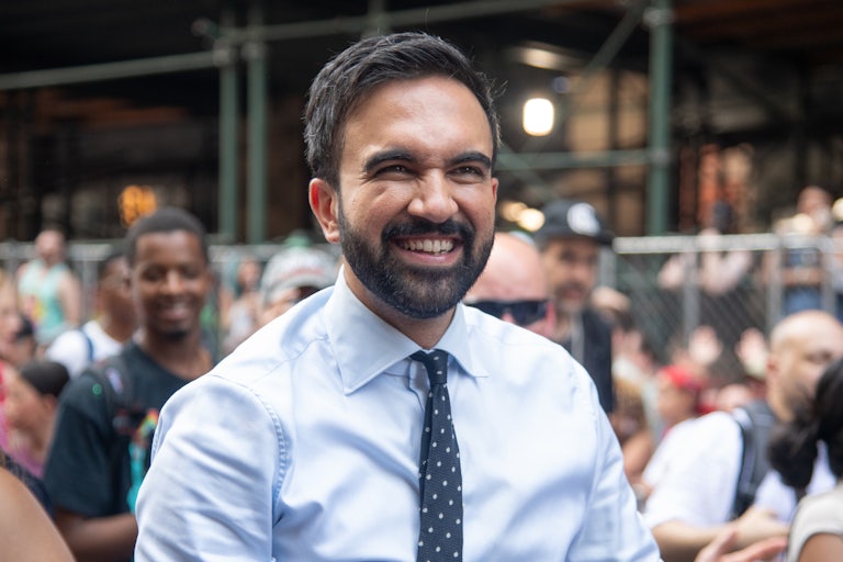 New York Democratic mayoral candidate Zohran Mamdani smiles while walking in the New York City Pride parade