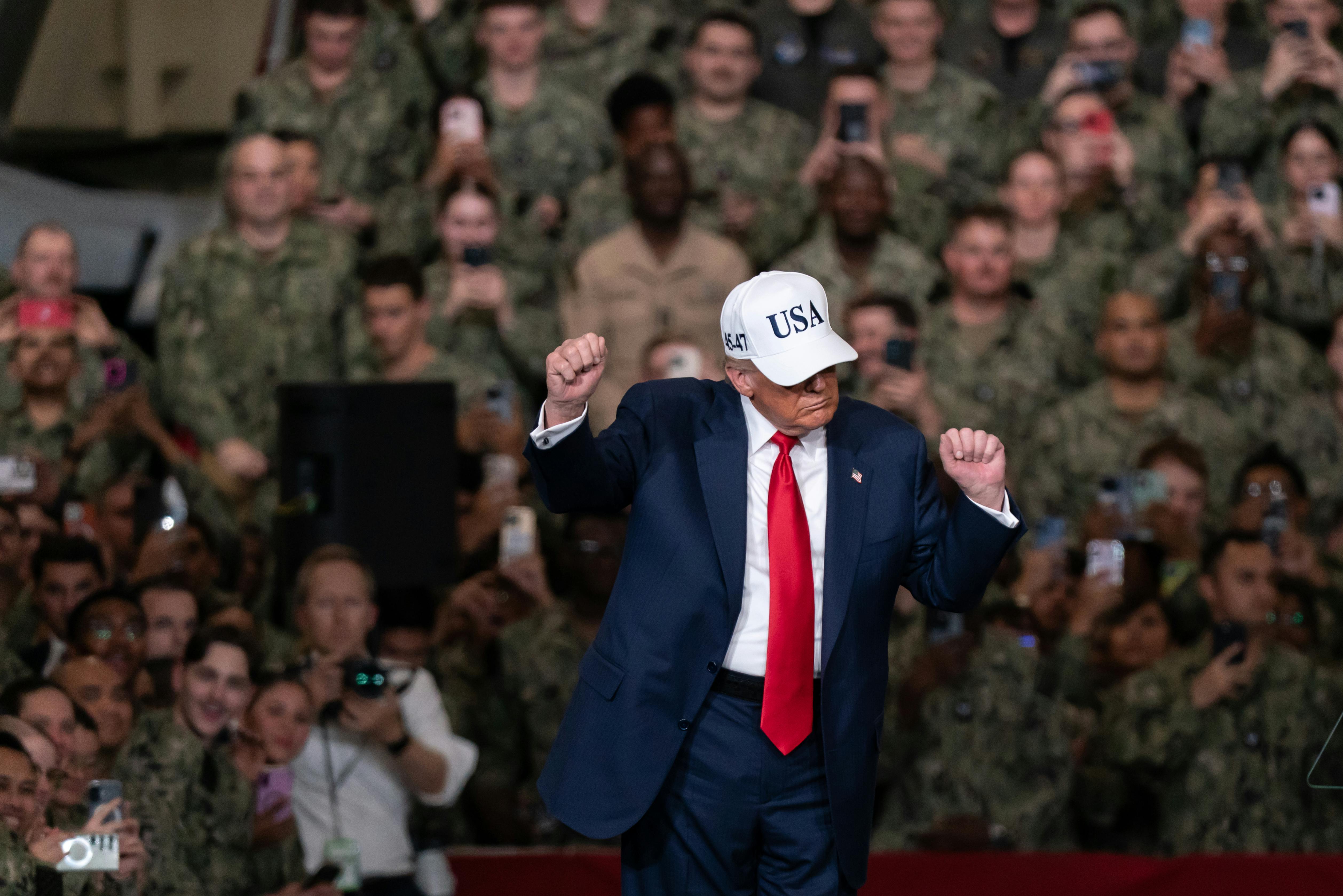 Donald Trump dances in front of troops on the USS George Washington