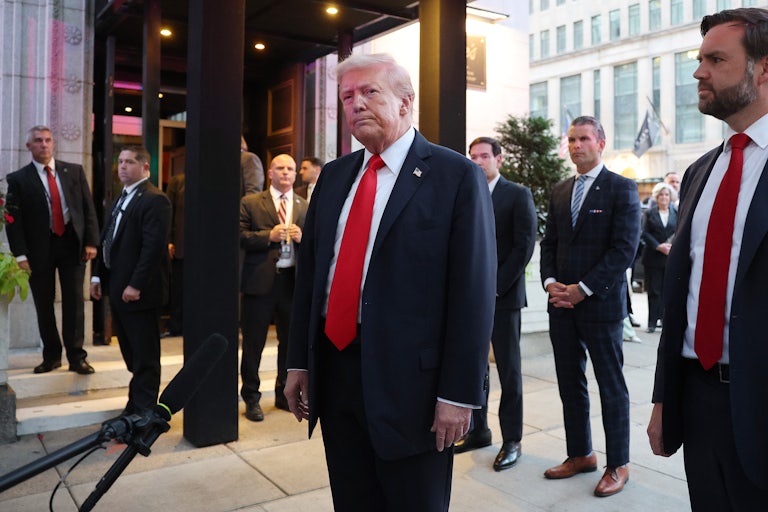 Trump stands outside of a D.C. restaurant.