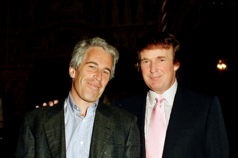 Jeffrey Epstein and Donald Trump smile for the camera while standing next to each other.