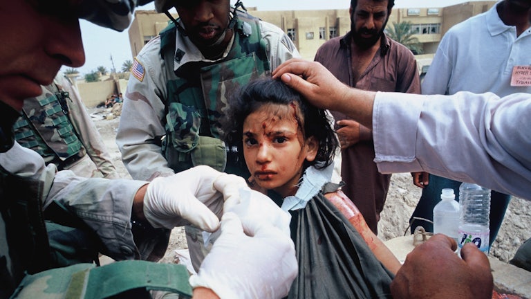 U.S. Army medics treat a young Iraqi girl