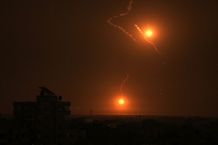 Flares fired by the Israeli military light up the sky east of Khan Yunis