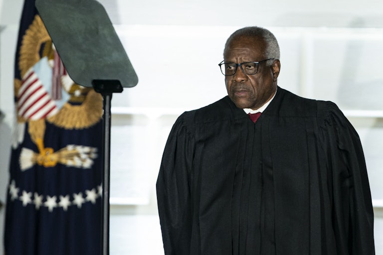 Clarence Thomas looks to the side