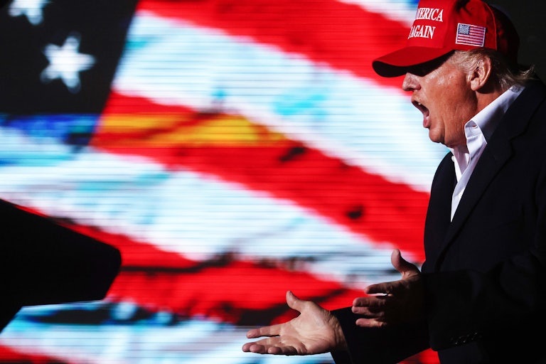 Donald Trump shouts at a rally in Arizona.