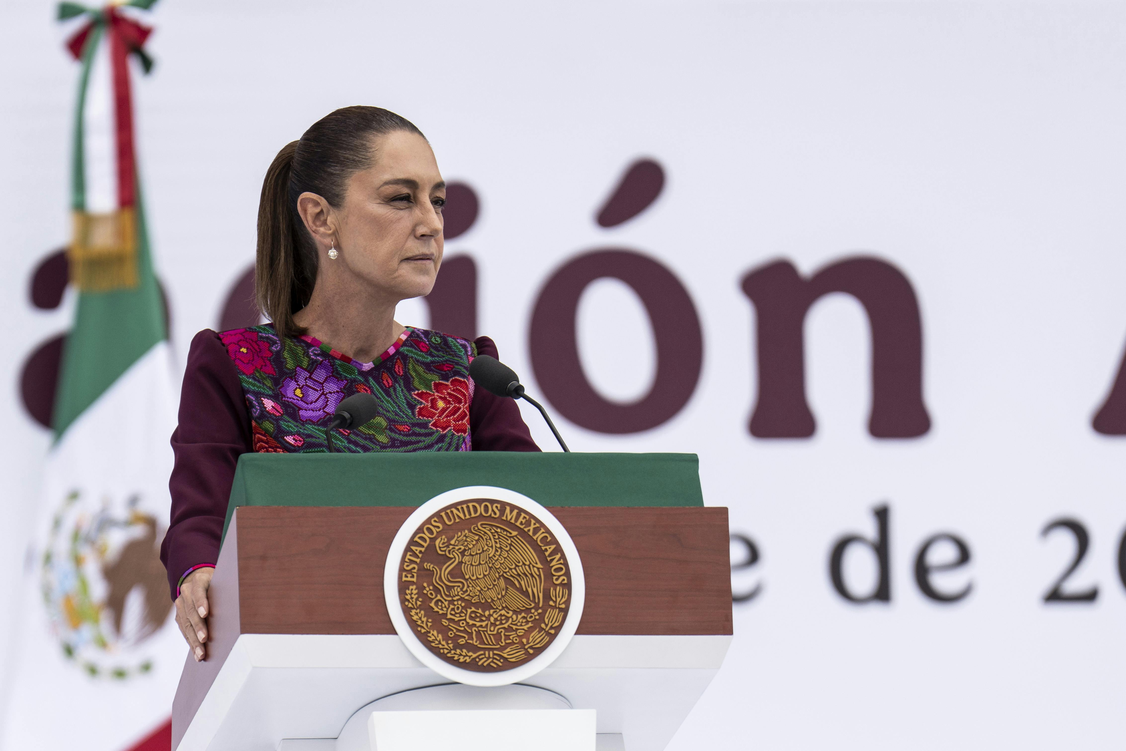 Mexican President Claudia Sheinbaum speaks at a podium.