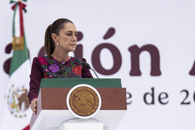 Mexican President Claudia Sheinbaum speaks at a podium.