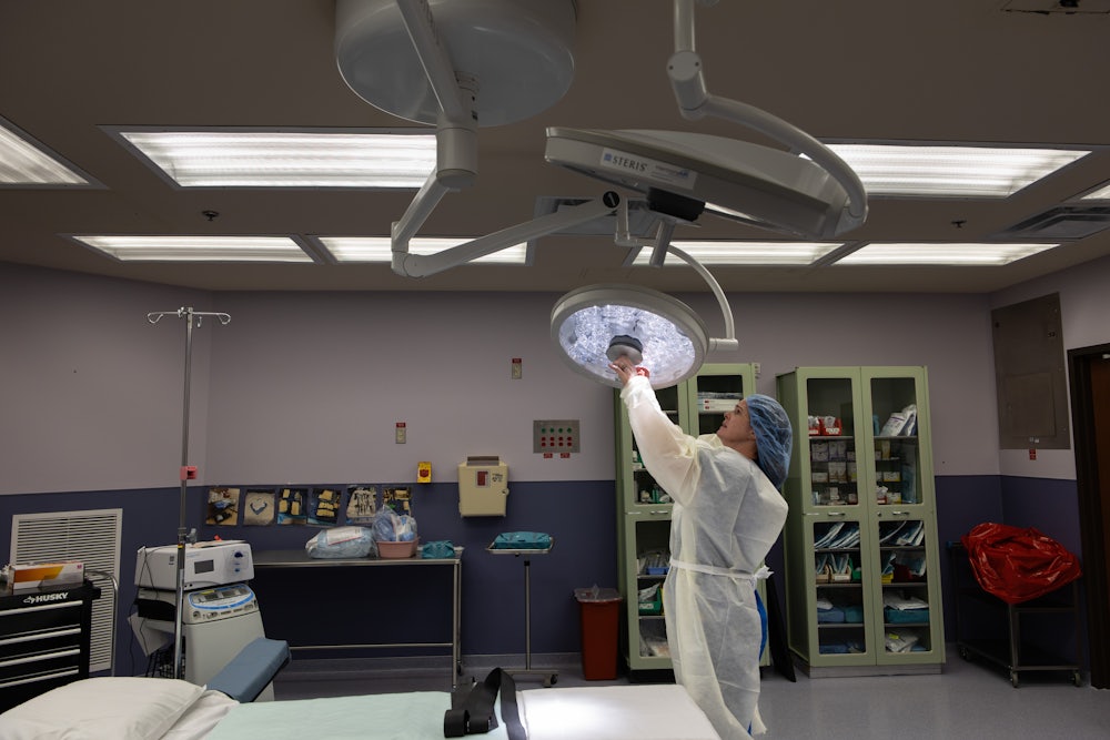 Registered nurse Brandi Gregory turns on an operating light at Medina Regional Hospital in Hondo, Texas
