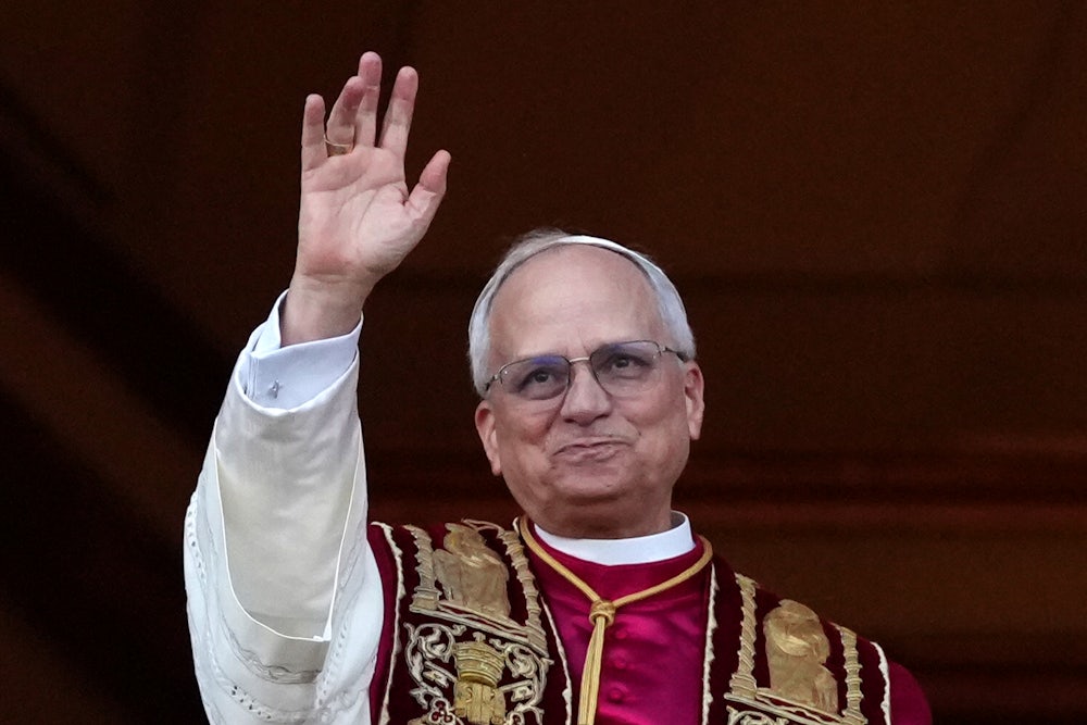 Pope Leo waves to a crowd (not pictured)