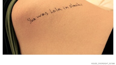 "She was Lola in slacks" written on a part of a girl's body (unclear)