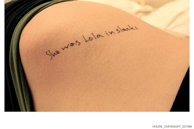 "She was Lola in slacks" written on a part of a girl's body (unclear)