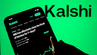 "Will Iran effectively close the Strait of Hormuz for 7+ days?" question on phone with Kalshi logo in the background