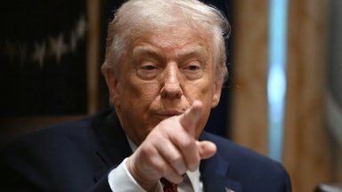 Donald Trump points while speaking during a roundtable
