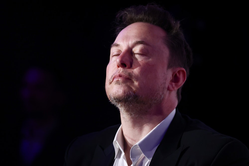 Elon Musk, owner of Tesla and the X (formerly Twitter) platform, tilts his head back and closes his eyes as he attends a symposium on fighting antisemitism titled 'Never Again : Lip Service or Deep Conversation' in Krakow, Poland on January 22nd, 2024.