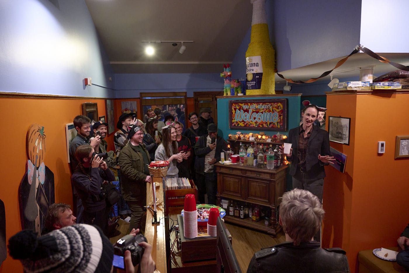 Katie Wilson, wearing rat ears, speaks during a campaign event at Seattle's Pike Place Market
