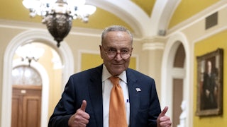 Chuck Schumer gives a thumbs up.
