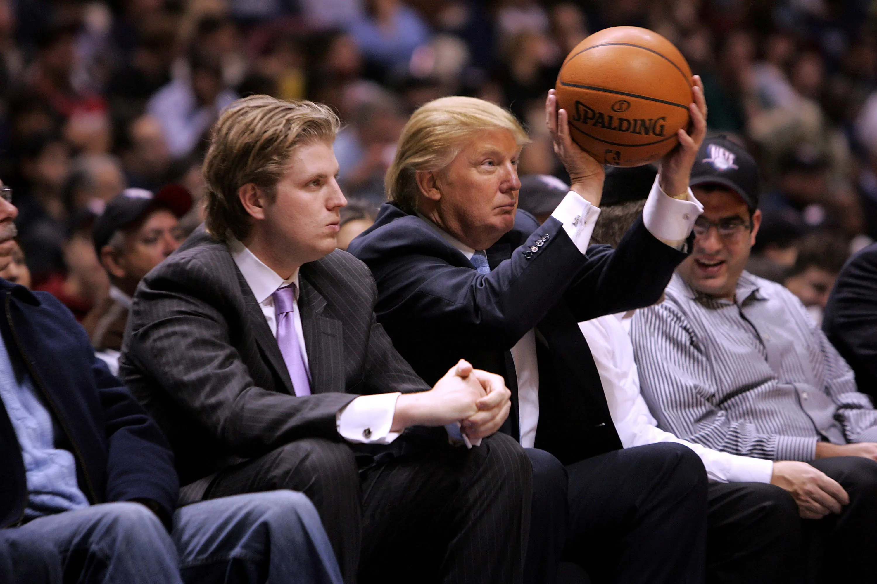 Trump sitting next to his son Eric displays whack shooting form 