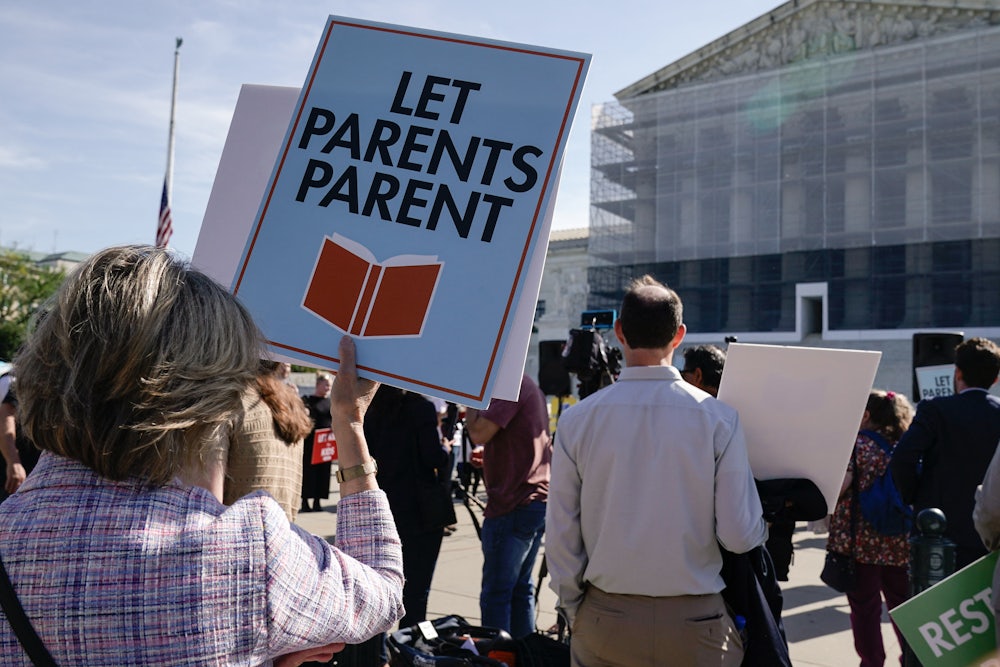 People supporting the right to remove children from classes containing LGBTQ-related content demonstrated outside the Supreme Court during oral arguments