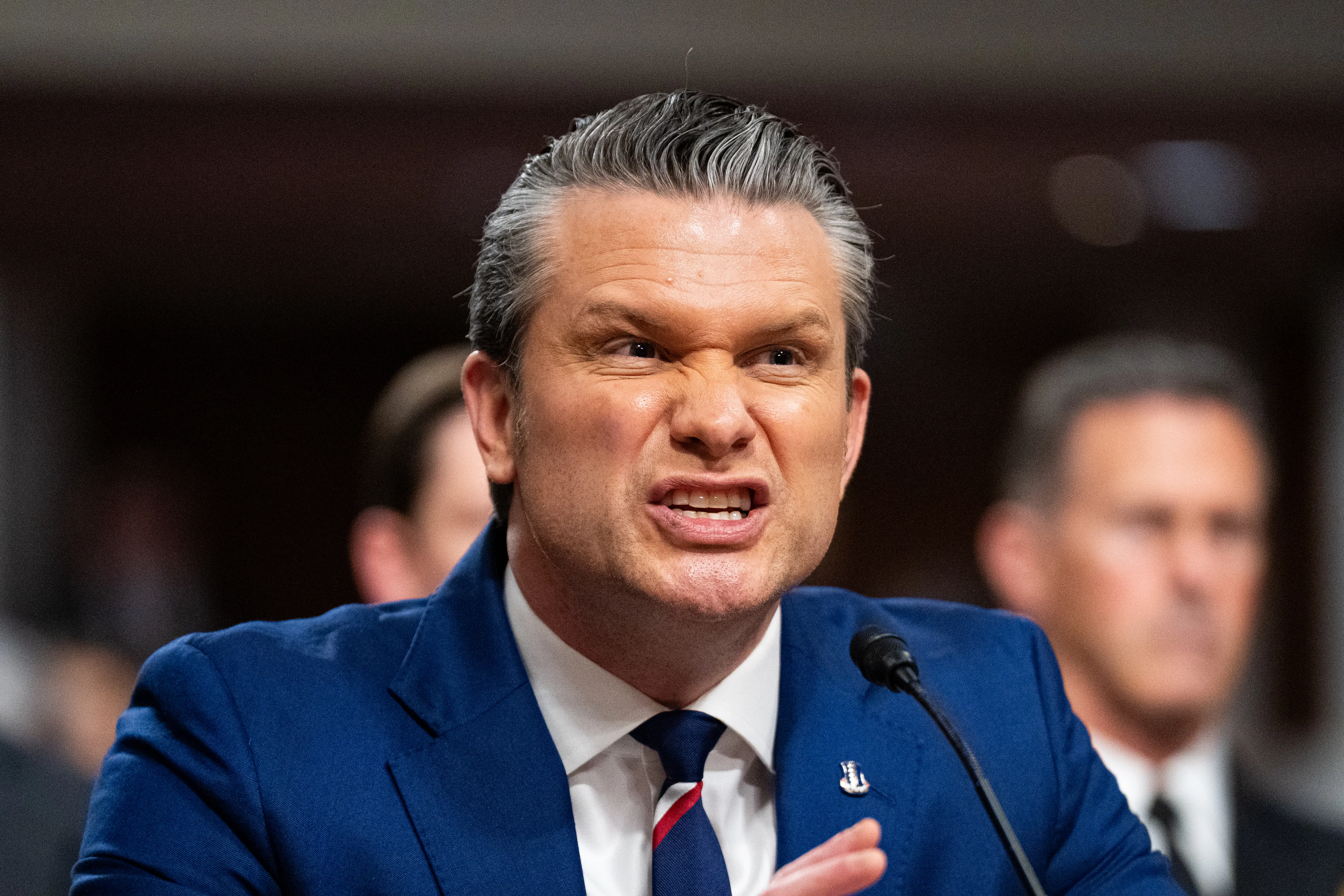 Defense Secretary Pete Hegseth speaks into a microphone during a Senate hearing