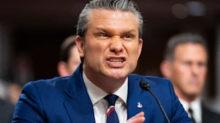 Defense Secretary Pete Hegseth speaks into a microphone during a Senate hearing