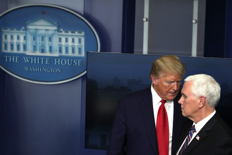 Donald Trump looms over Mike Pence.