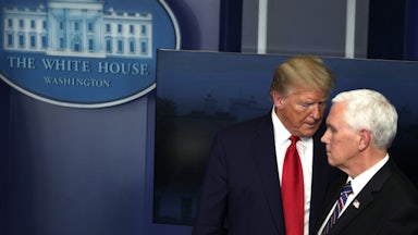 Donald Trump looms over Mike Pence.