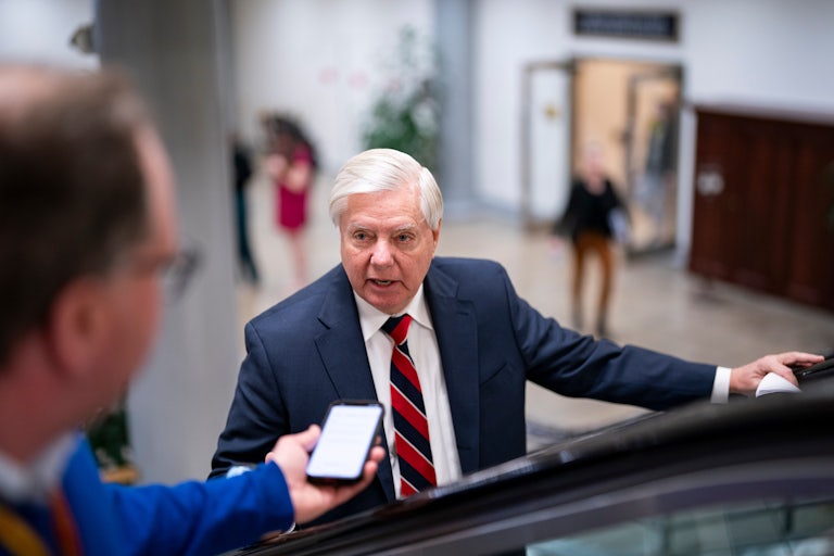 Lindsey Graham yelling and pointing at something off camera